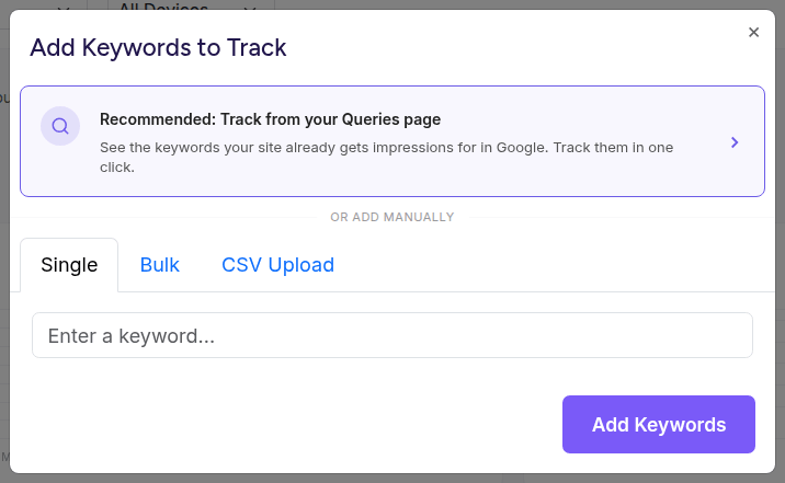 The Add Keywords modal offering the track-from-your-real-queries path above the manual entry tabs